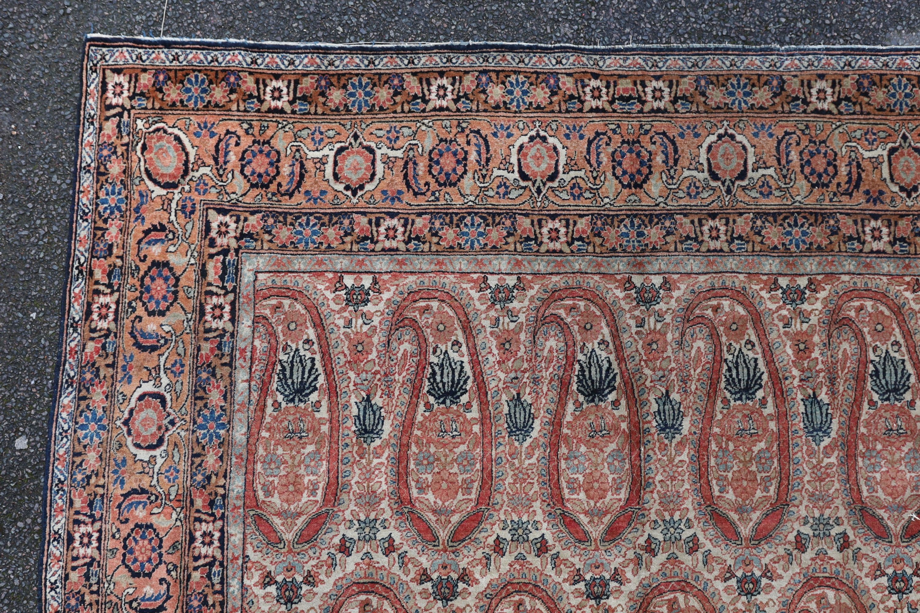 A Kerman rug ivory ground carpet, 360 x 218cm.